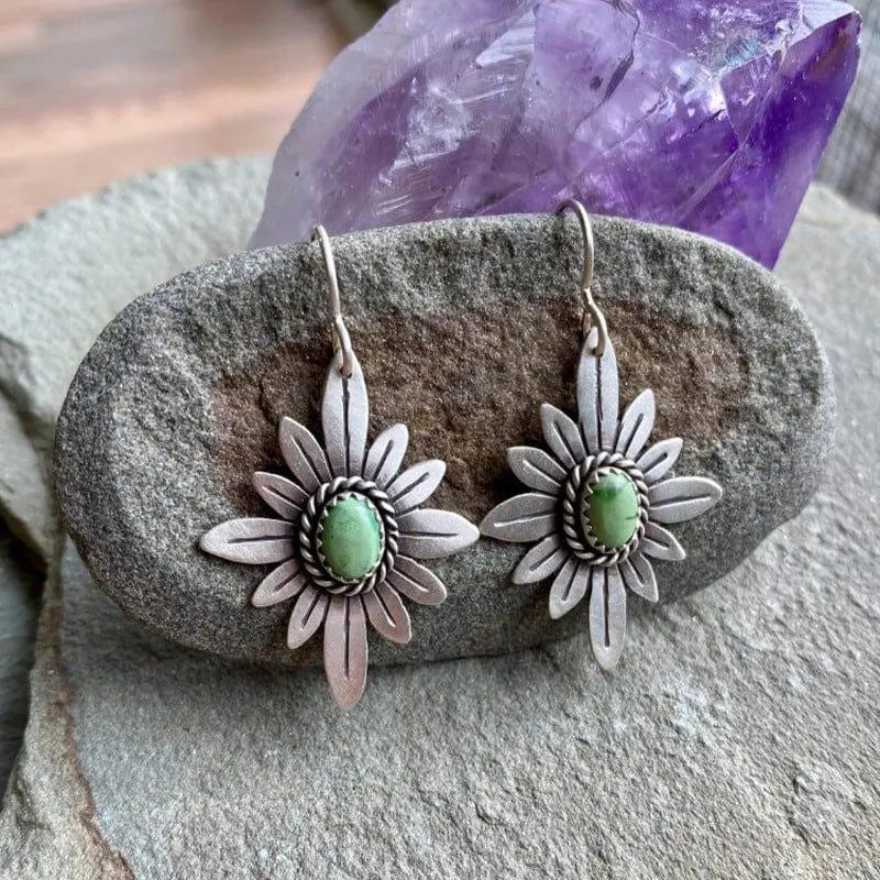 Silver lotus earrings with green stones