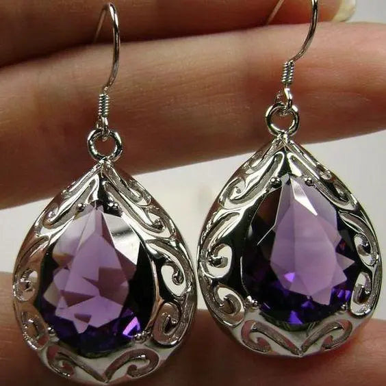 Silver earrings with purple crystal drops