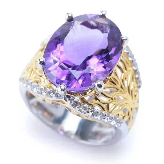 Silver and gold ring with purple glass