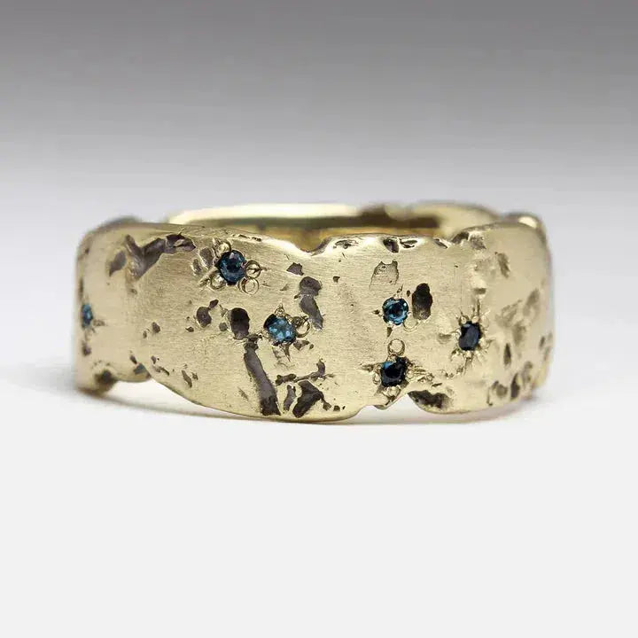 Gold ring with blue crystal