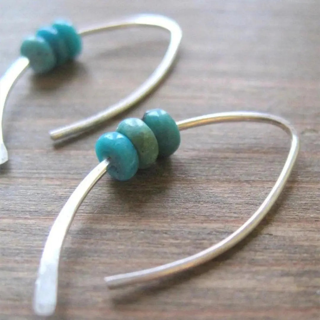 Wave-shaped boho earrings with turquoise stones in sterling silver