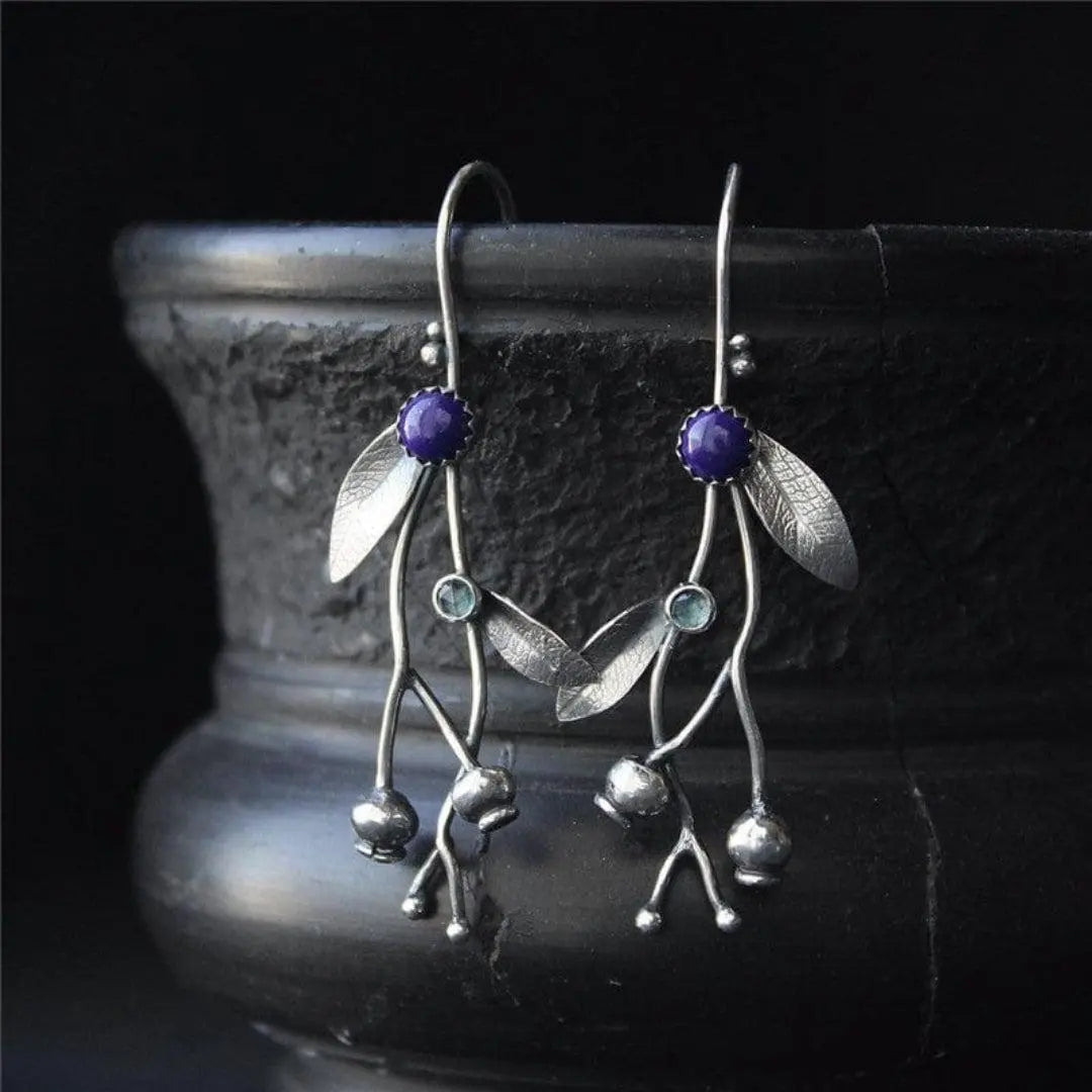 Silver earrings in the shape of leaves