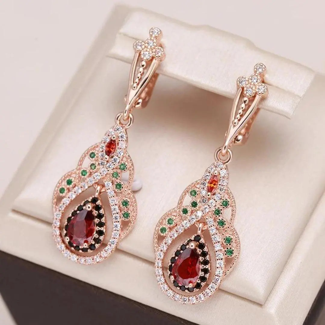 Gold earrings with red mandala and zircons