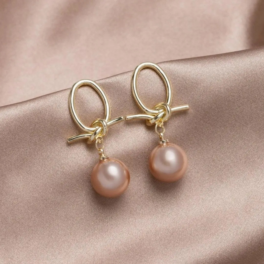 Gold hoop earrings with pearls