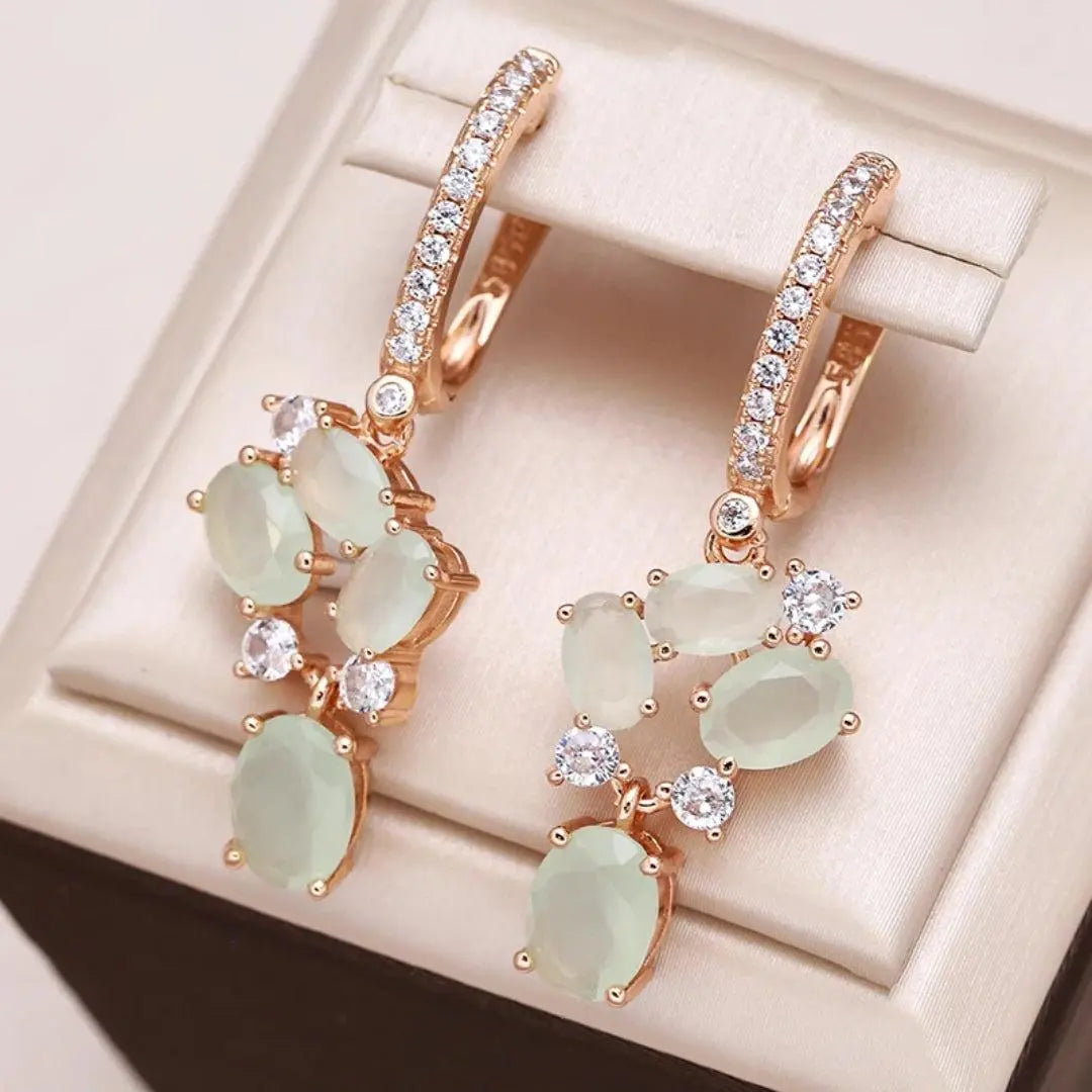 Sparkling earrings with gold-colored crystals