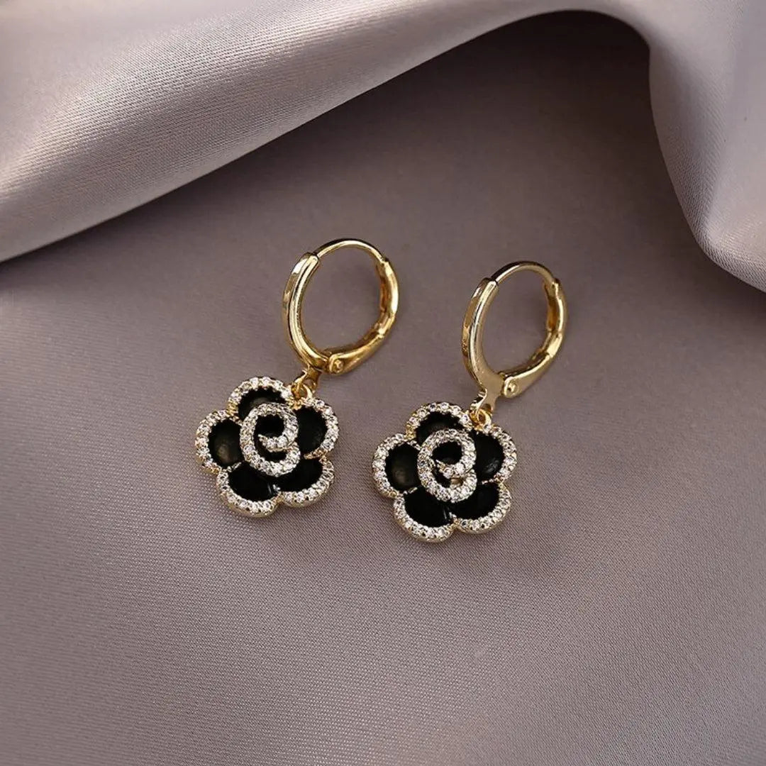 Elegant earrings with black lotus
