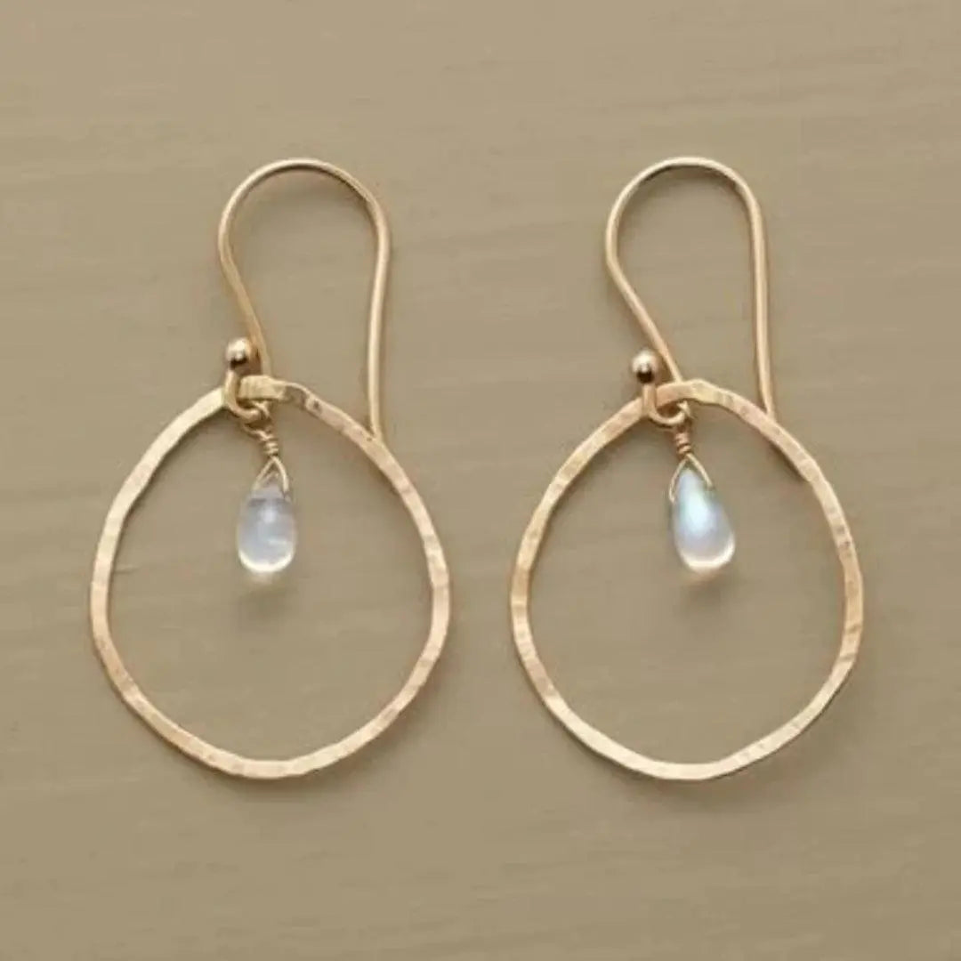 Gold earrings with white crystals in vintage style