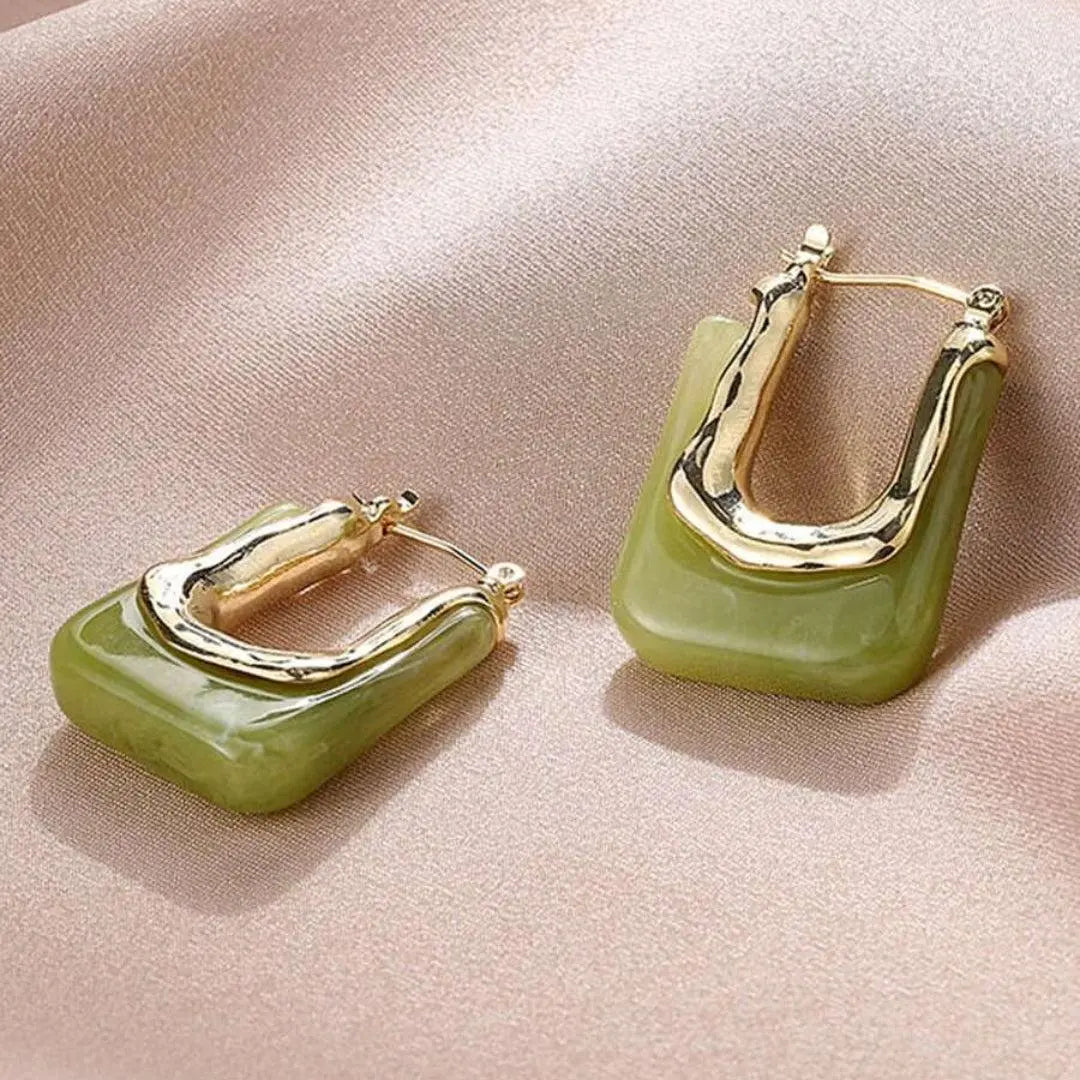 Gold vintage earrings with green enamel