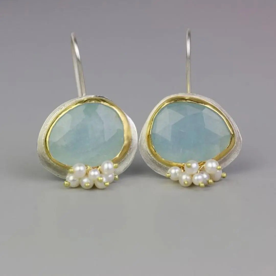 Vintage earrings with light blue stone