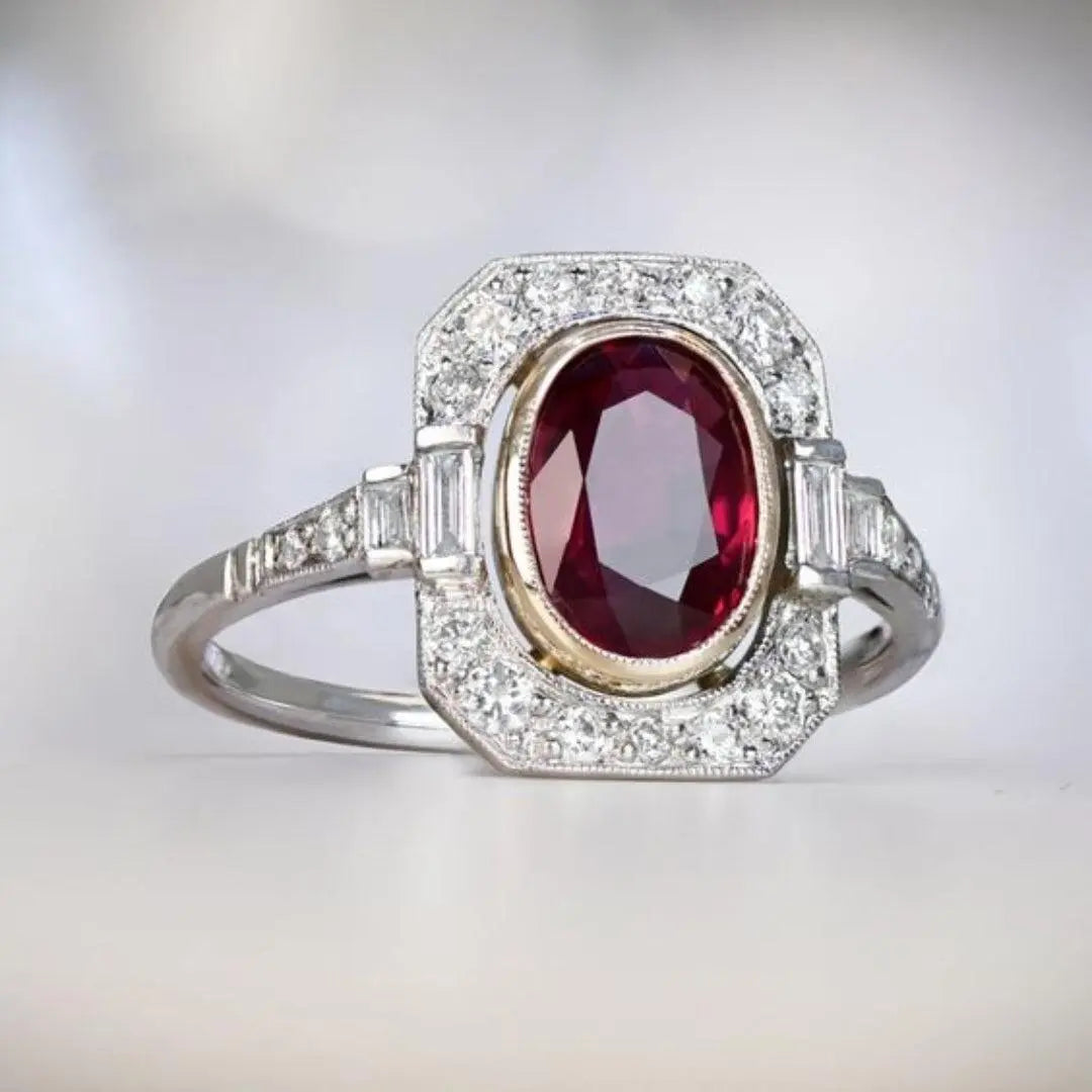 Silver ring with red zircons