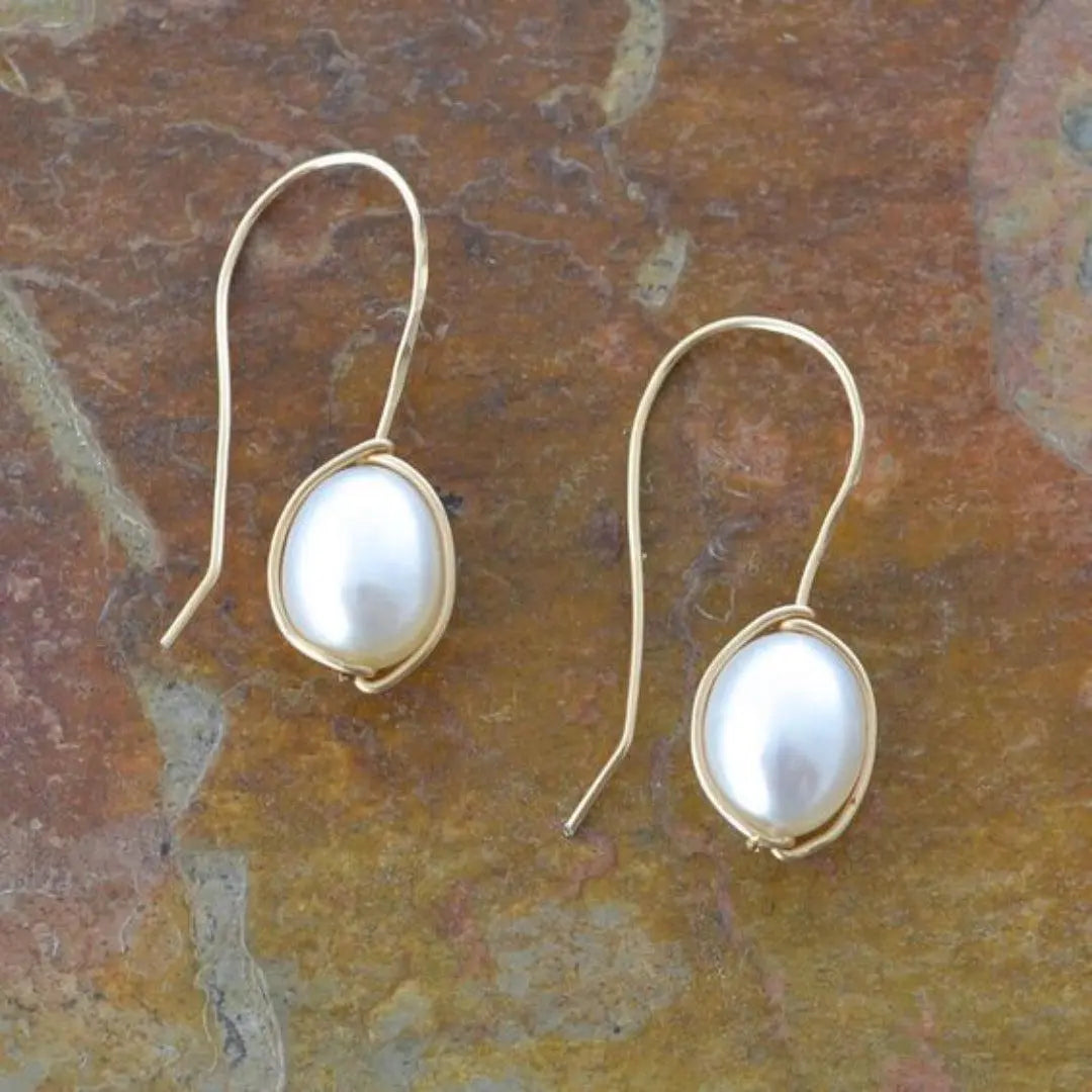 Gold earrings with pearls in vintage style