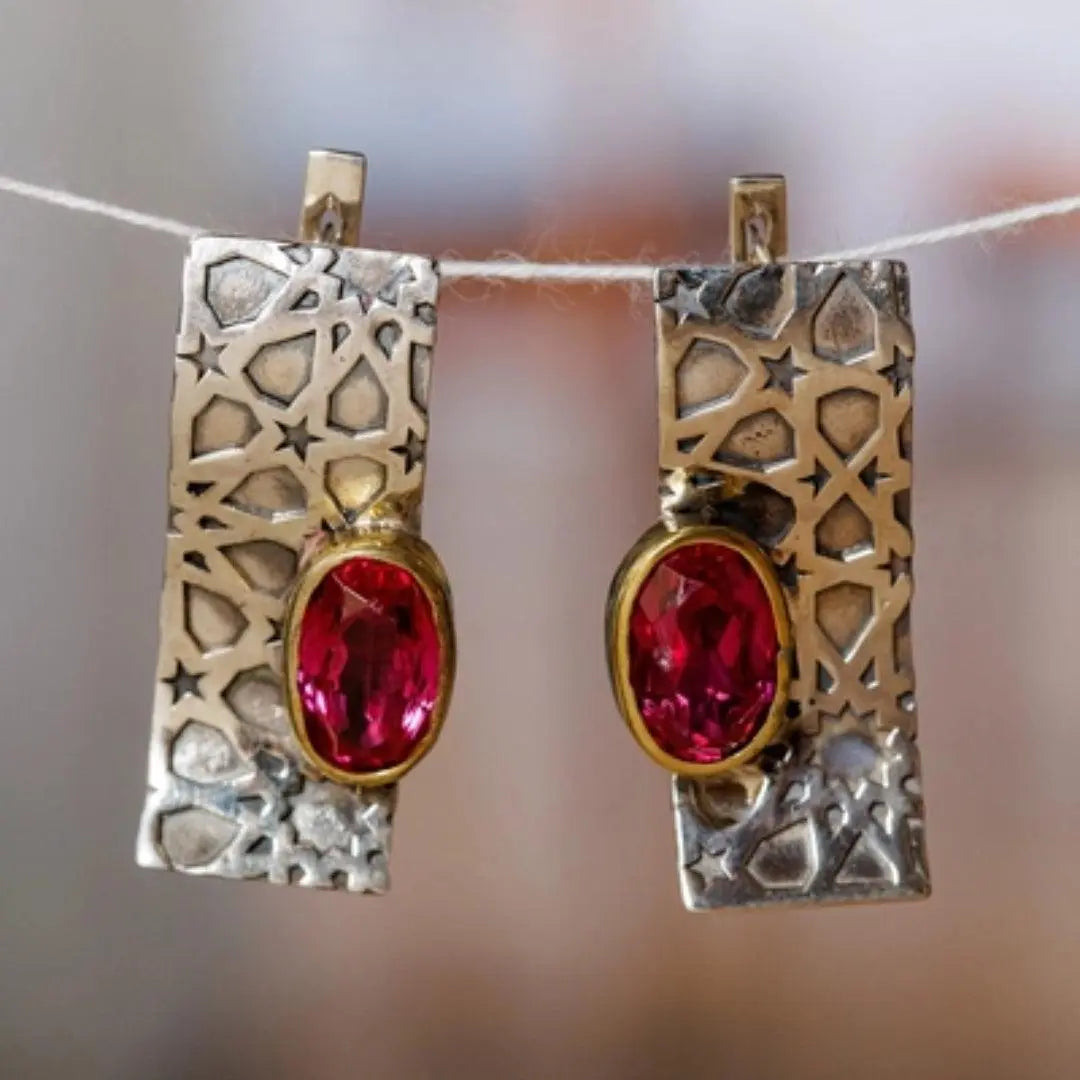 Gold and silver earrings with red zirconia in vintage style