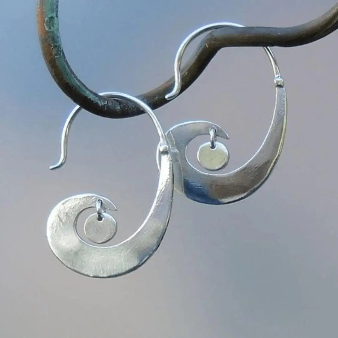 Silver vintage earrings in the shape of a wave