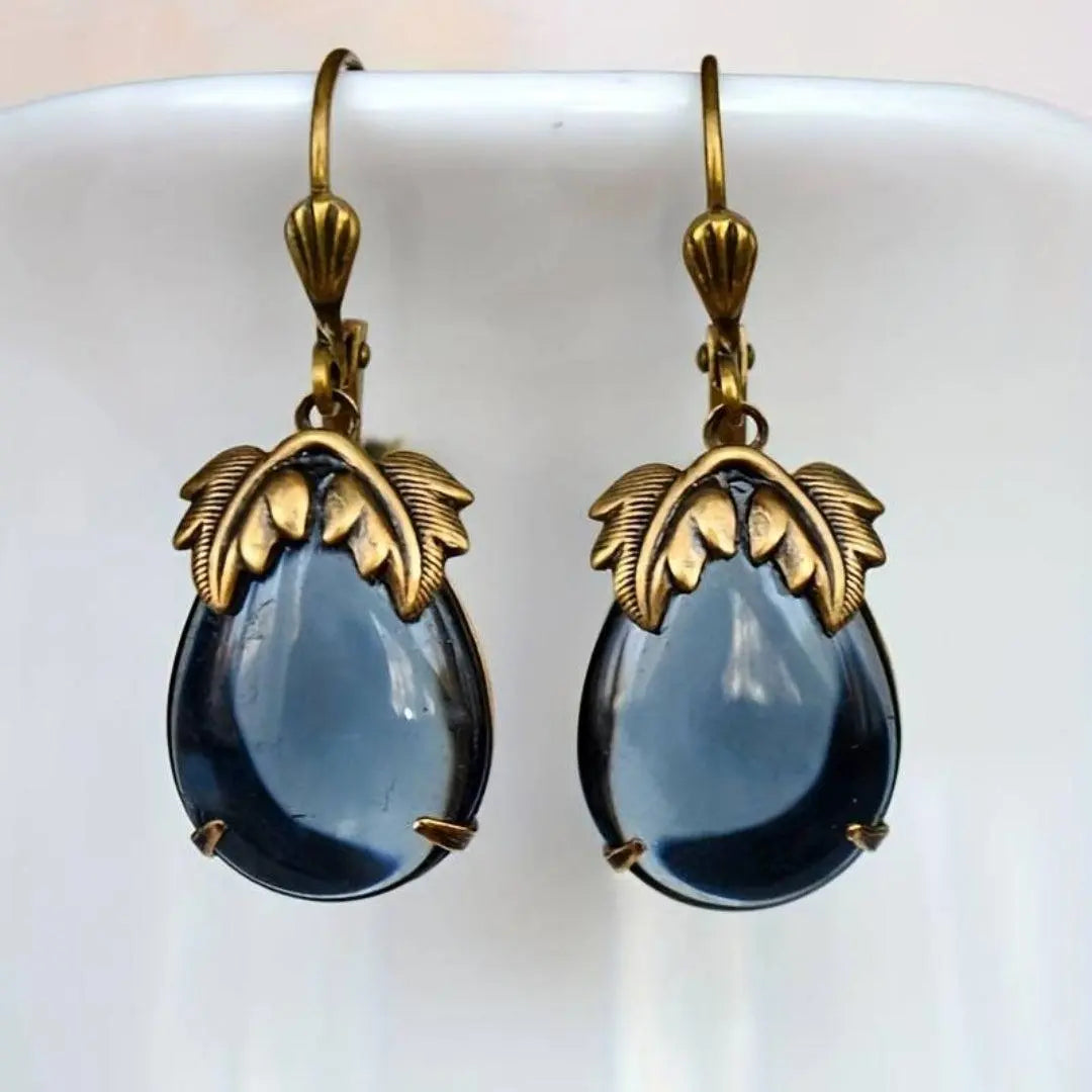 Gold vintage earrings with blue crystal drops
