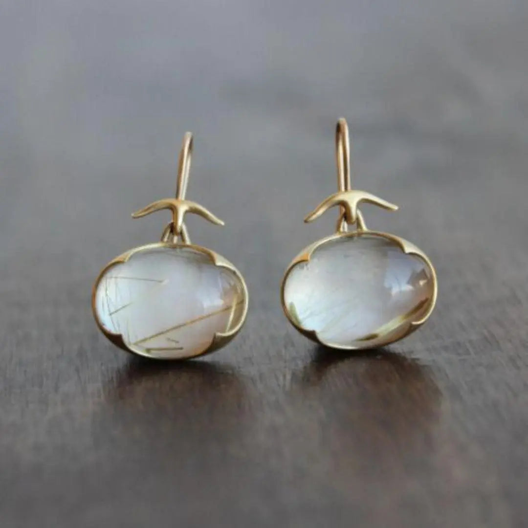 Gold earrings with moonstone