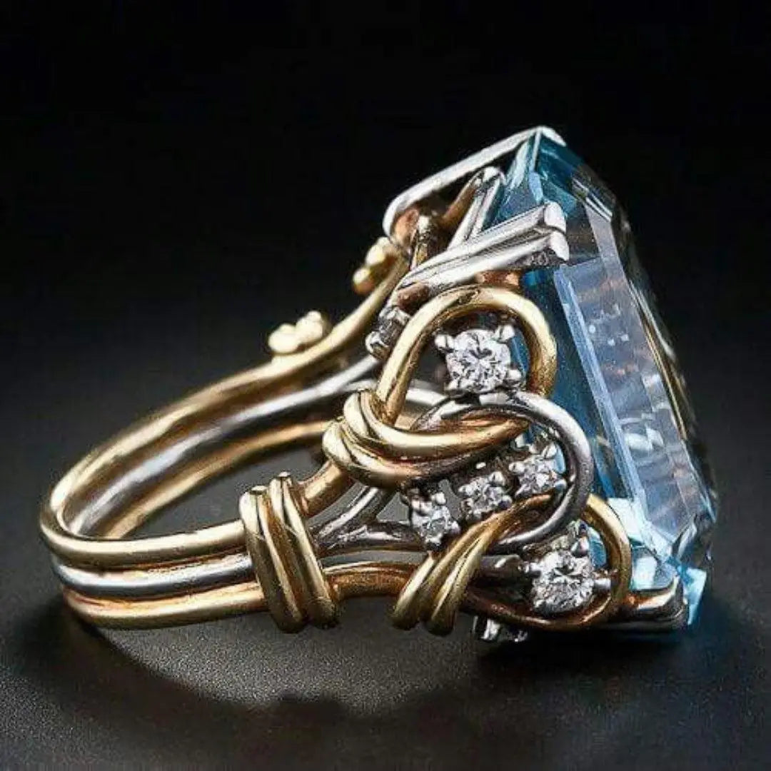 Gold ring with blue zirconia in vintage style