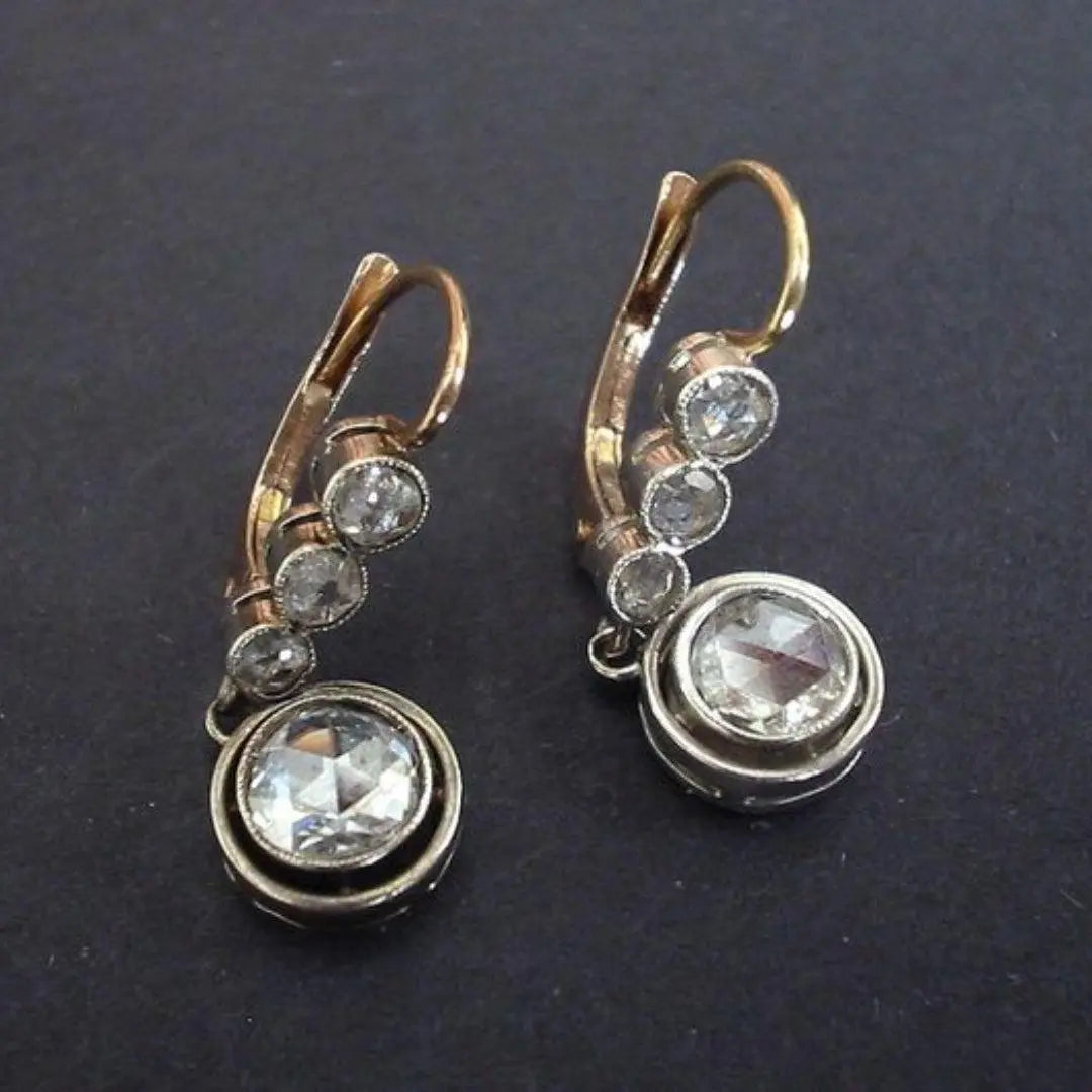 Gold earrings with zircons in vintage style