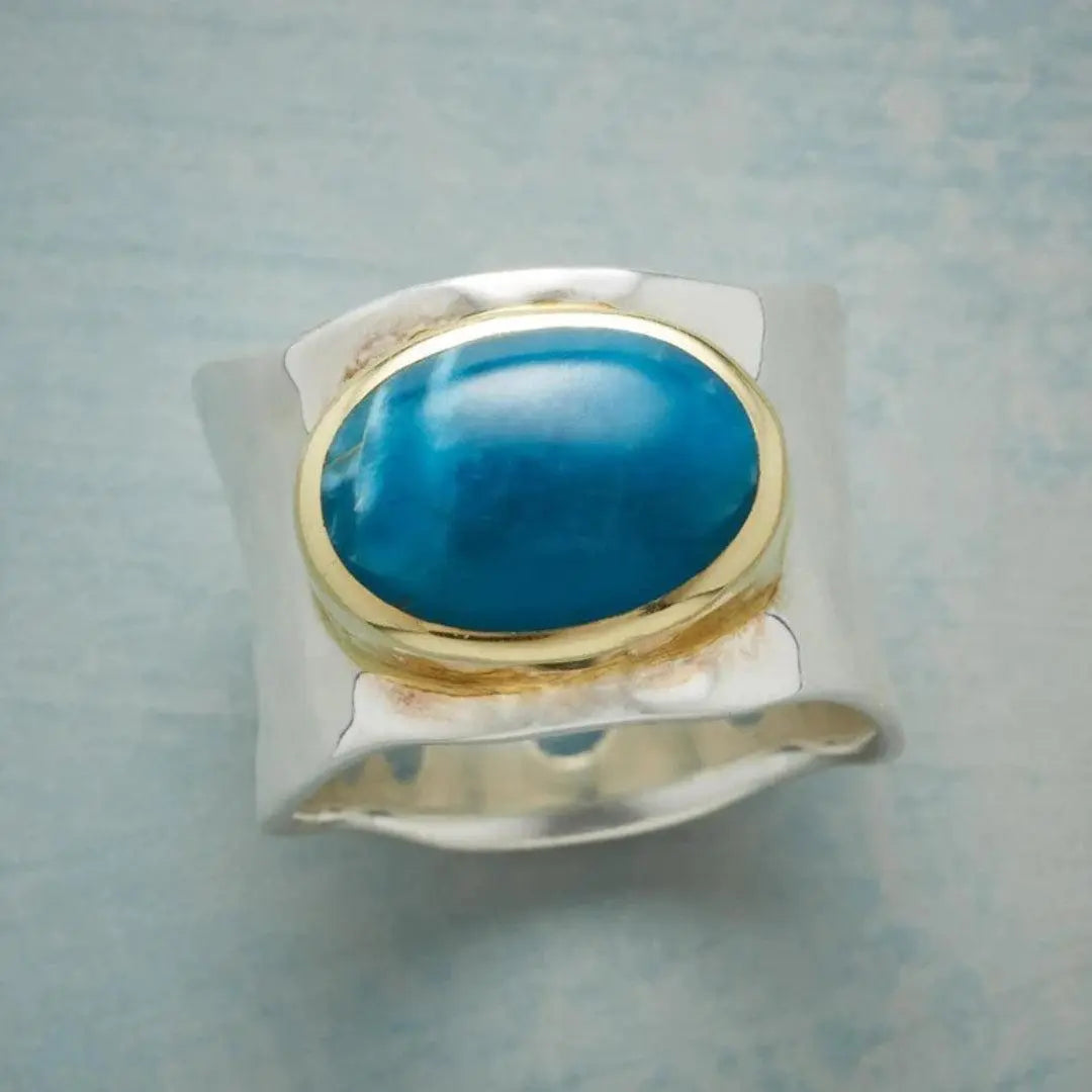 Silver ring with blue oval stone