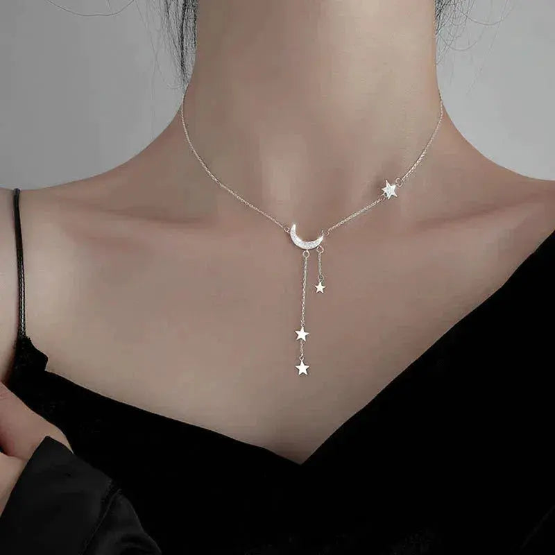 Silver necklace with moon and stars