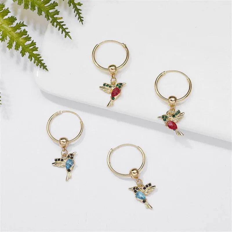 Limited edition: earrings with zircons in the shape of flying hummingbirds