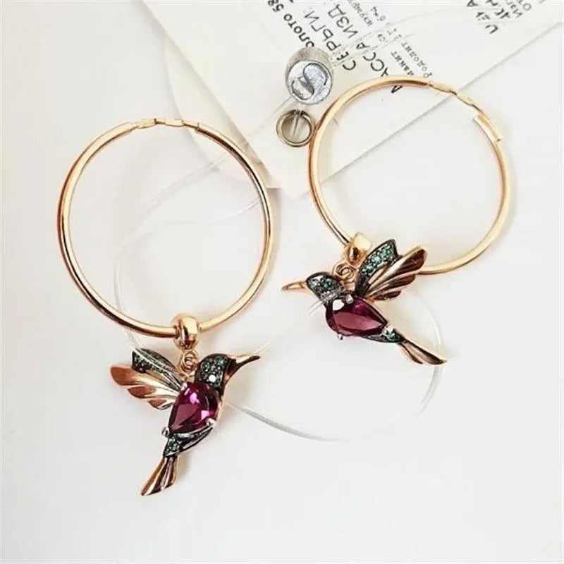 Limited edition: earrings with zircons in the shape of flying hummingbirds