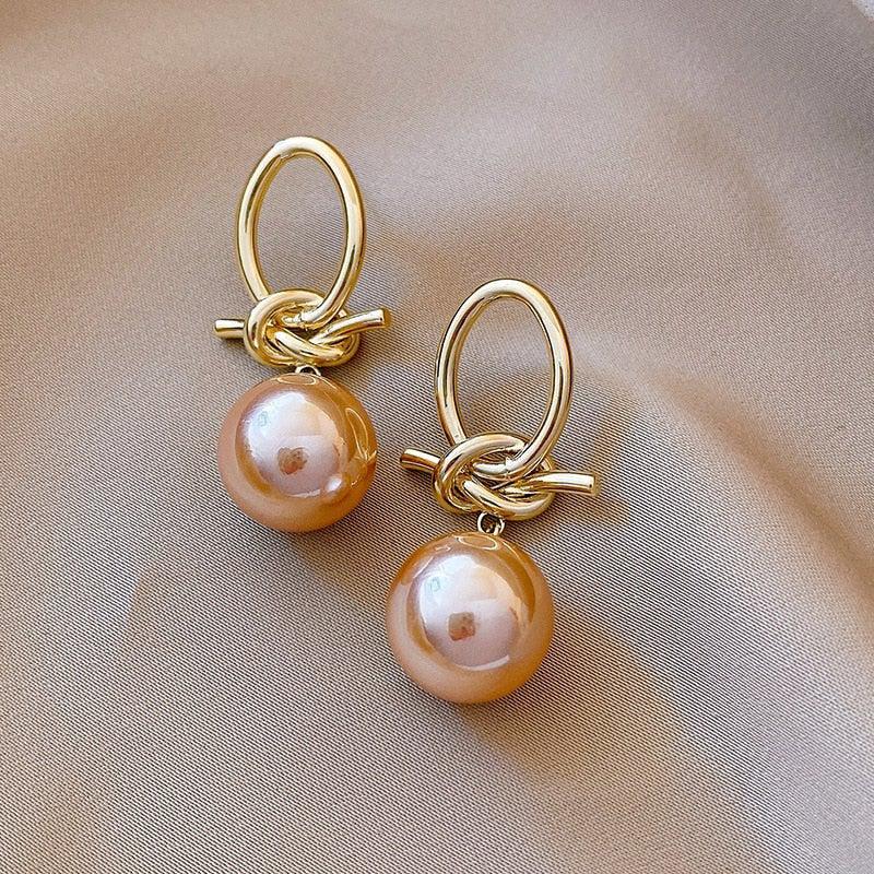 Gold hoop earrings with pearls