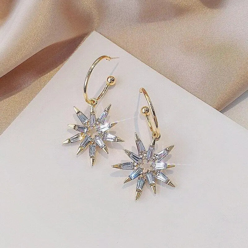 Gold and silver star earrings