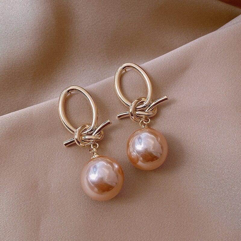 Gold hoop earrings with pearls