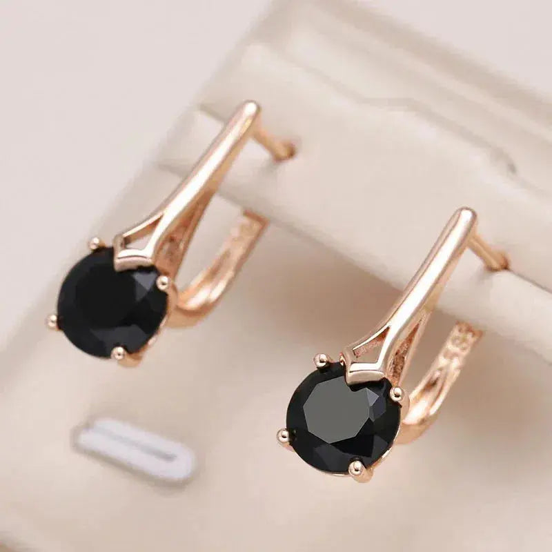 Elegant gold earrings with black crystals