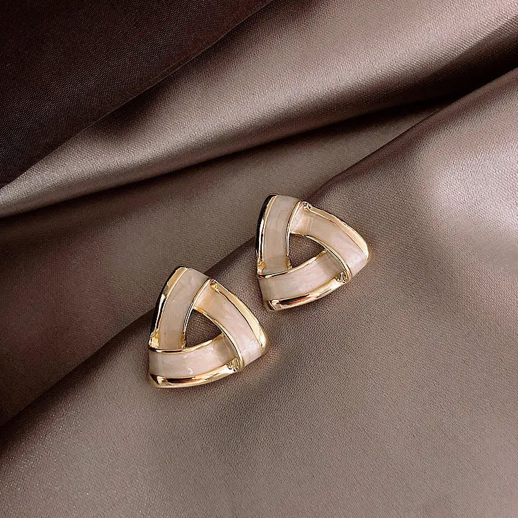 Modern geometric gold earrings with pearls