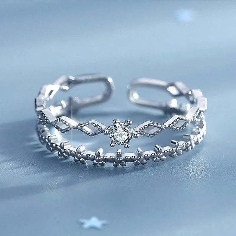 Adjustable silver ring with zircons