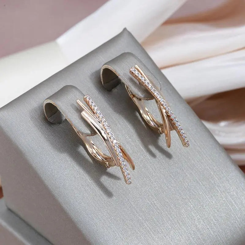 Exquisite gold cross earrings with diamonds