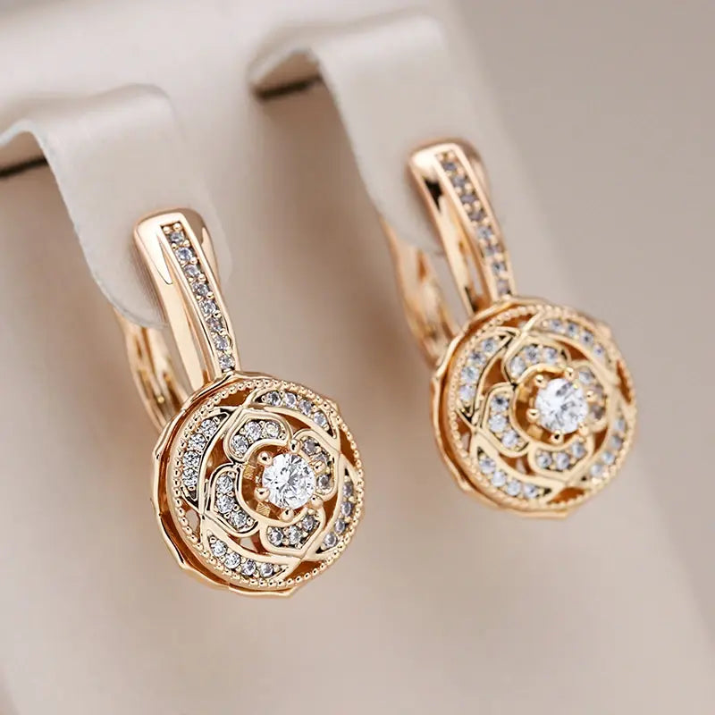 Elegant gold earrings with round zircons