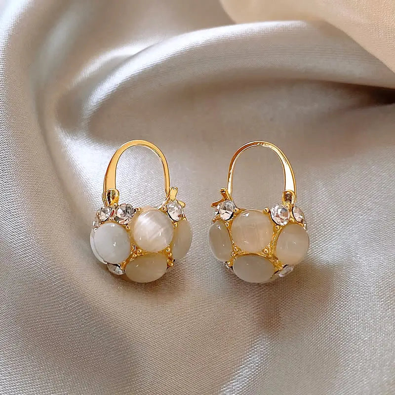 Gold earrings with pearls and crystals