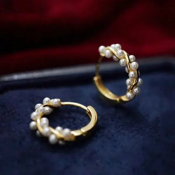 Gold-plated earrings with interlaced pearls