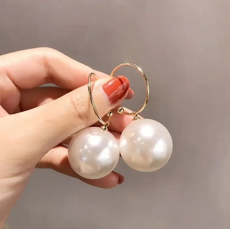 Elegant large earrings with pearls
