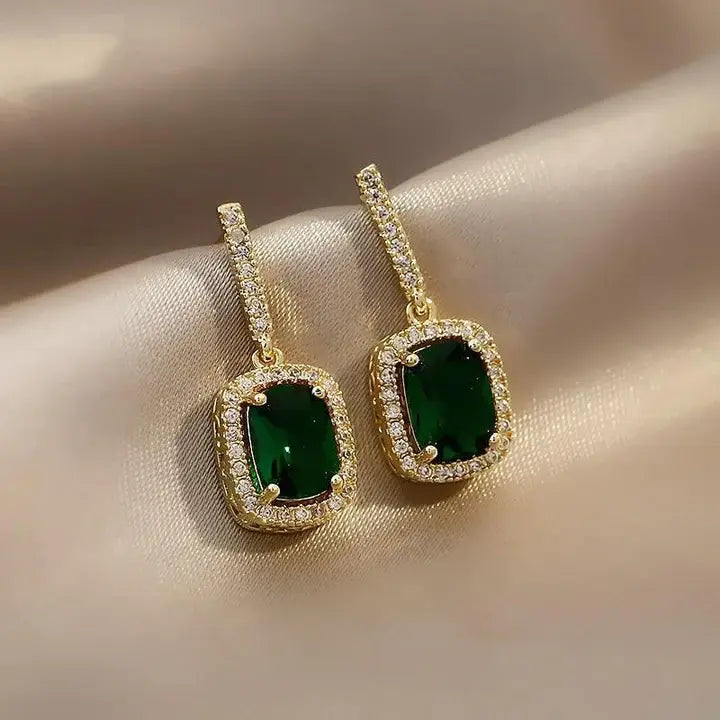 Elegant earrings with sparkling green crystals