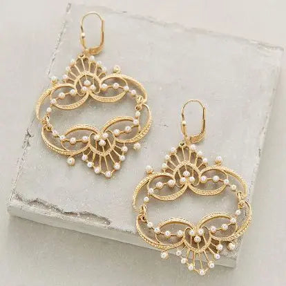 Gold mandala pearl earrings in vintage style