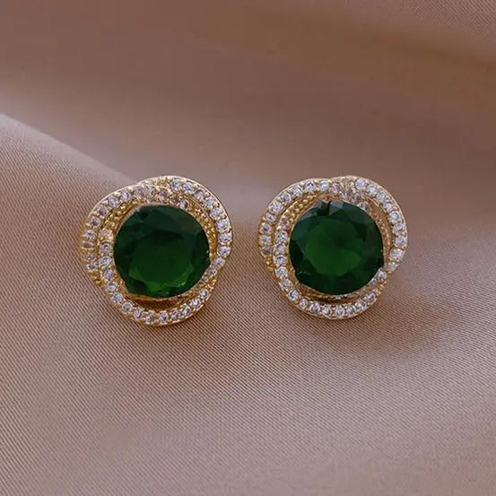 Green earrings with a shiny spiral