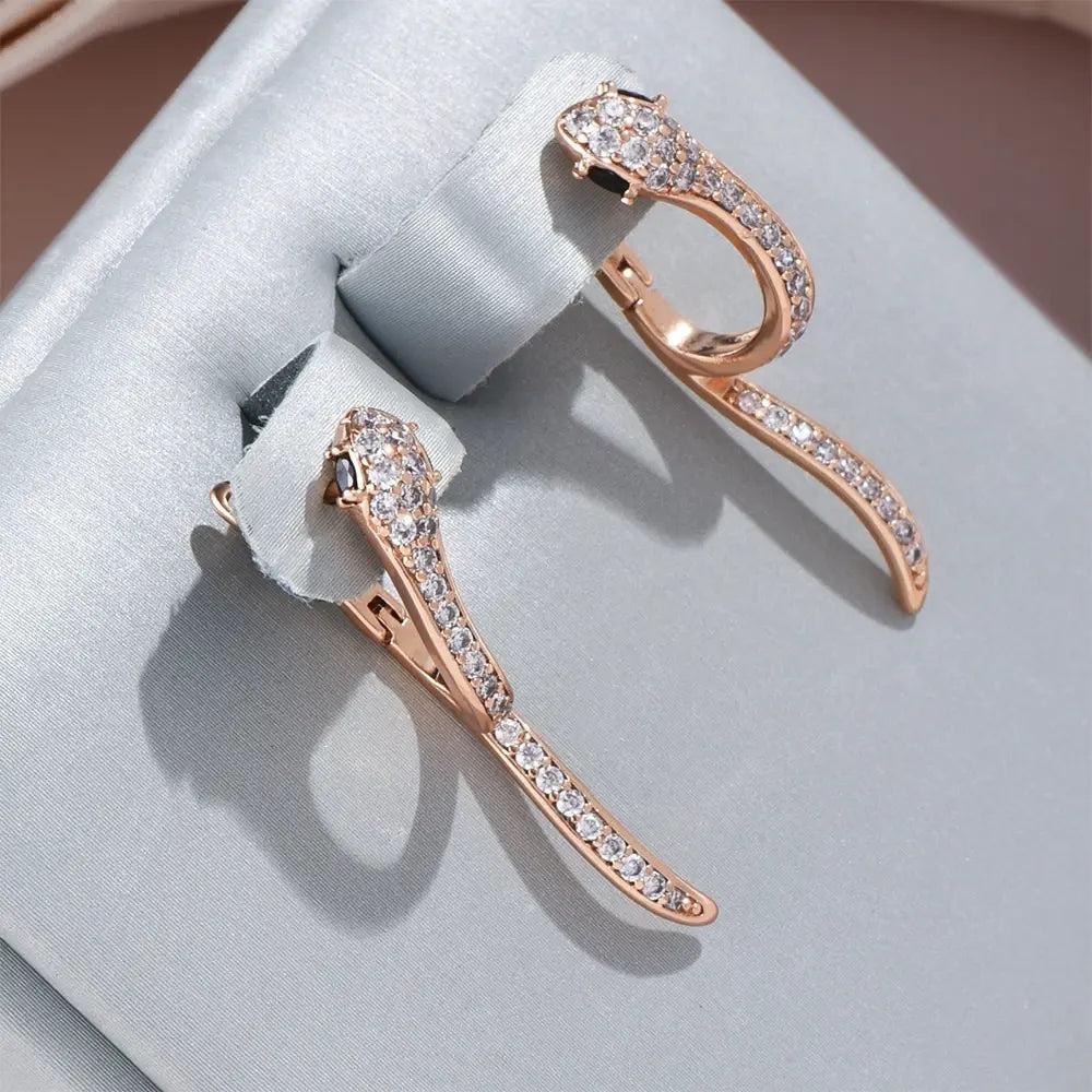 Elegant earrings with a white snake
