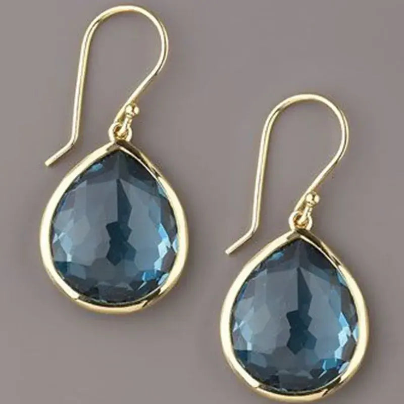 Gold earrings with blue crystals