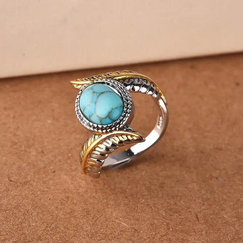 Turquoise vintage style ring in gold and silver