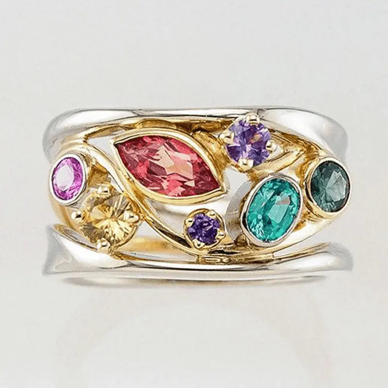 Gold and silver ring with colored zircons