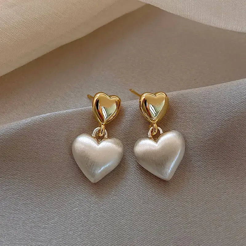 Elegant gold heart earrings with pearls