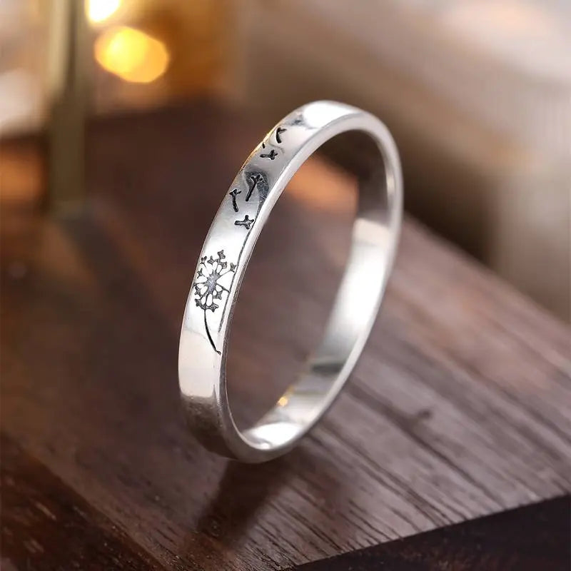 Silver ring with dandelion