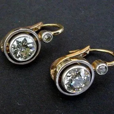 Gold vintage style earrings with inlaid zircons