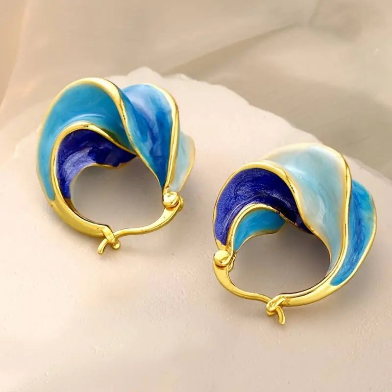 Gold earrings with blue enamel in vintage style