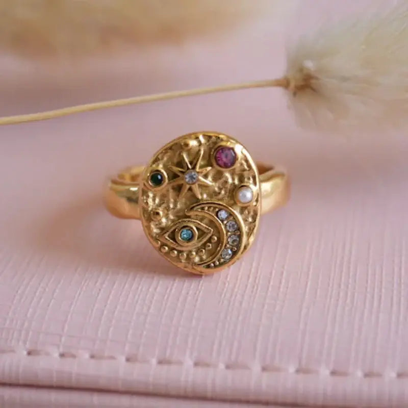 Vintage gold ring with inlay of colored stones