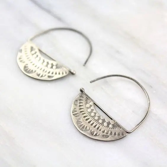 Silver vintage style earrings with a hollow crest