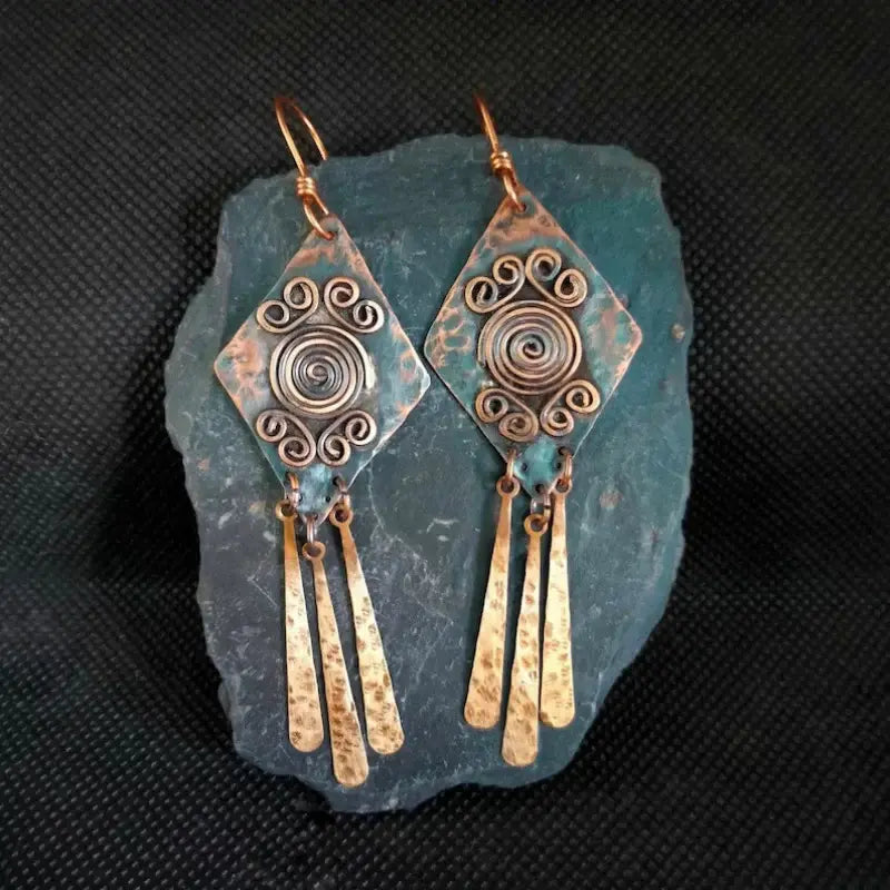 Hanging vintage earrings in bronze color